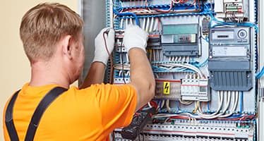Electrician Wiring Commercial Switchboard — Plumbers & Electricians in Ulladulla, NSW