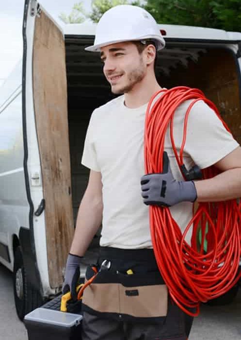 Electrician wearing white — Plumbers & Electricians in Wollongong, NSW