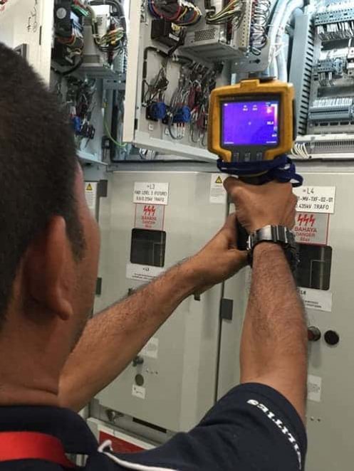 Technician checking electrical box — Plumbers & Electricians in the Southern Highlands, NSW