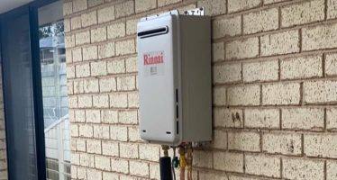 Hot Water System on Brick House — Plumbers & Electricians in the Wollongong Region, NSW