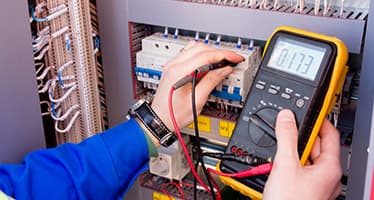 Testing Switchboard With a Multimeter — Plumbers & Electricians in Wollongong, NSW
